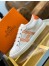 Hermes Avantage Sneakers In White/Orange Calfskin
