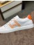 Hermes Avantage Sneakers In White/Orange Calfskin