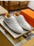 Hermes Quicker Sneakers In White/Orange Calfskin