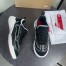 Christian Louboutin Women's Mara Sneakers in Black Mesh and Leather